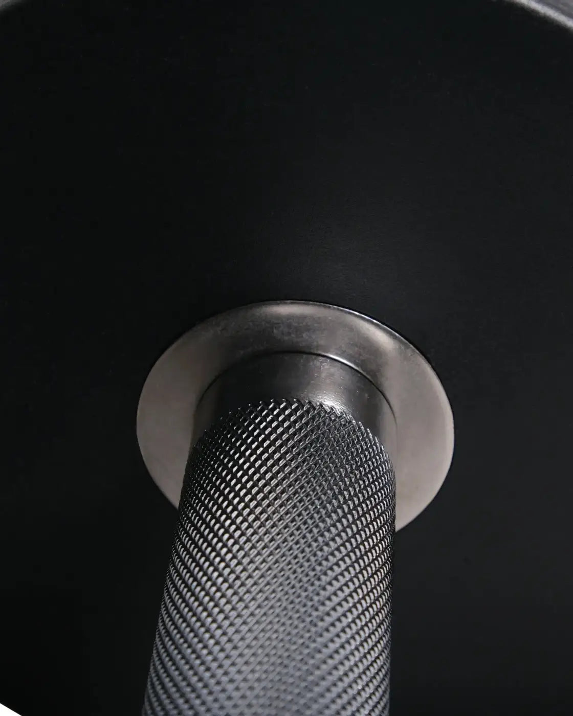 Black rubber dumbbell with textured matte grip and polished metallic collar for home fitness by Gym Gear Pro