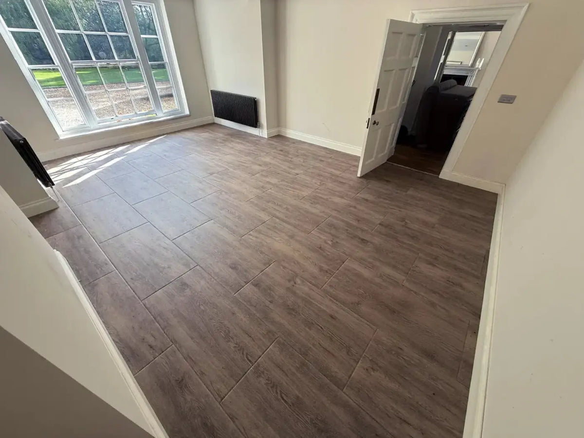 Gray wood-effect premium laminate flooring tiles 20mm thick with realistic grain pattern for home gyms