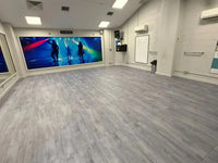 Gray wood-grain vinyl floor tiles 20mm wood effect premium flooring for home gyms measuring 1m by 0.5m