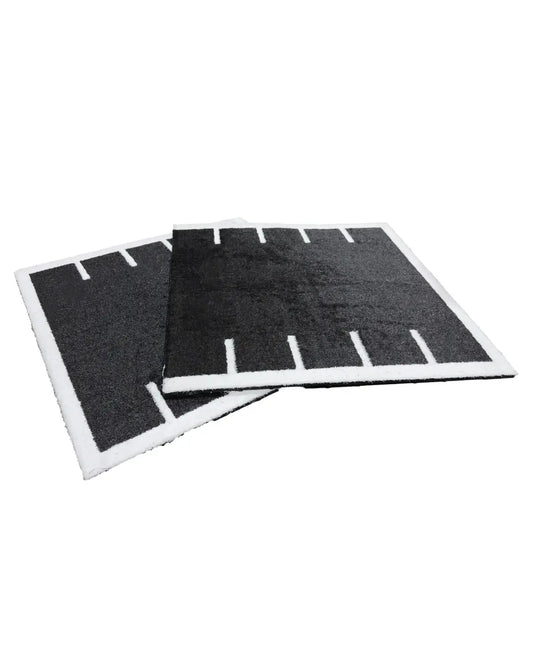 Black rectangular air filter pads with white foam borders and vertical slits for 30mm black premium sled track turf tile