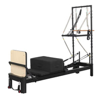 Black aluminium reformer with tower system and half trapeze featuring beige backrest and adjustable resistance bands