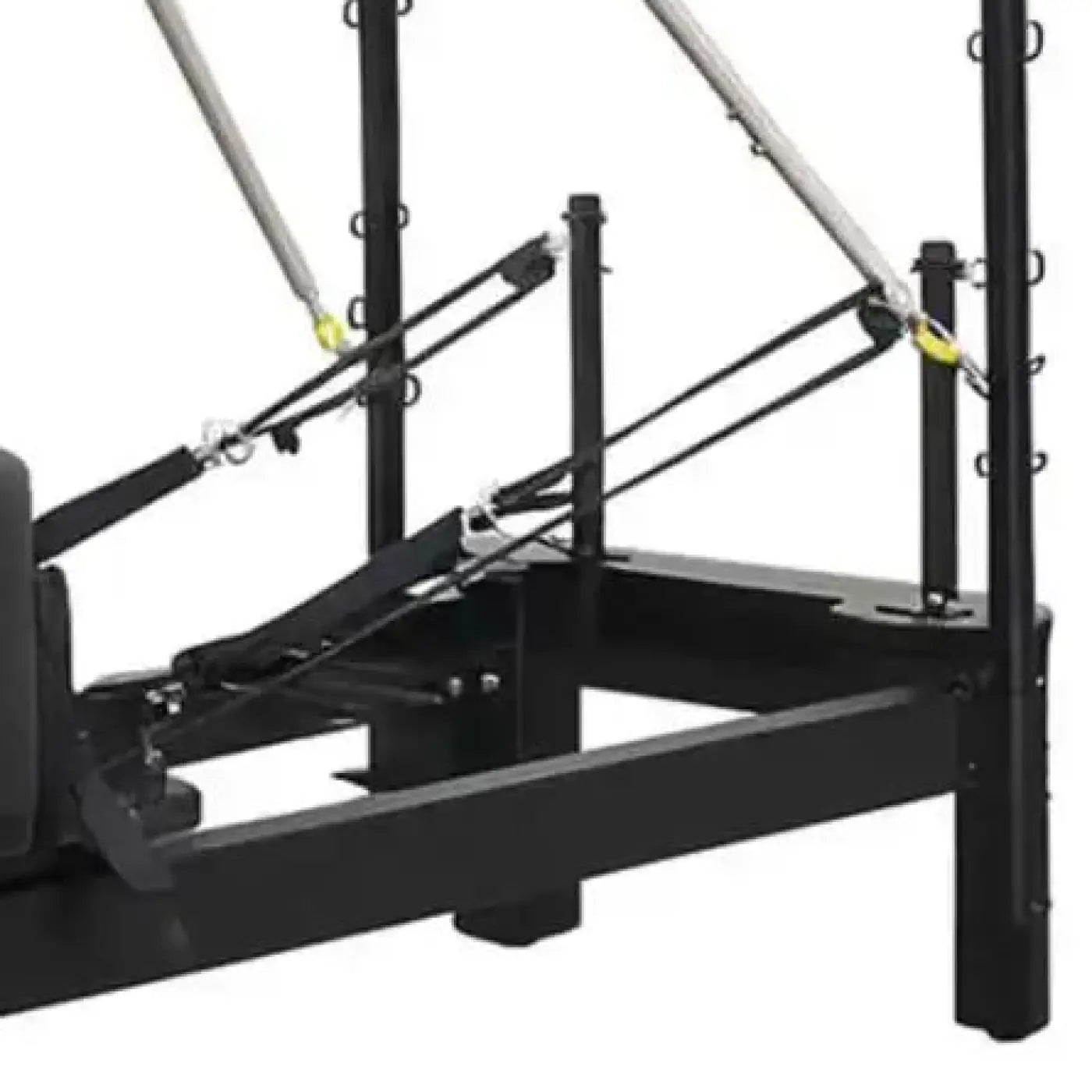Aluminium reformer with tower system half trapeze featuring black metal frame silver resistance bands and yellow hooks for home workout