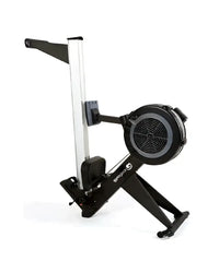 Black and silver blade 2.0 rower with circular flywheel, sturdy frame, and adjustable seat for home training