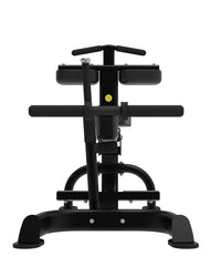 Black metal seated calf raise machine with yellow adjustment knob and padded seat for home gyms back view