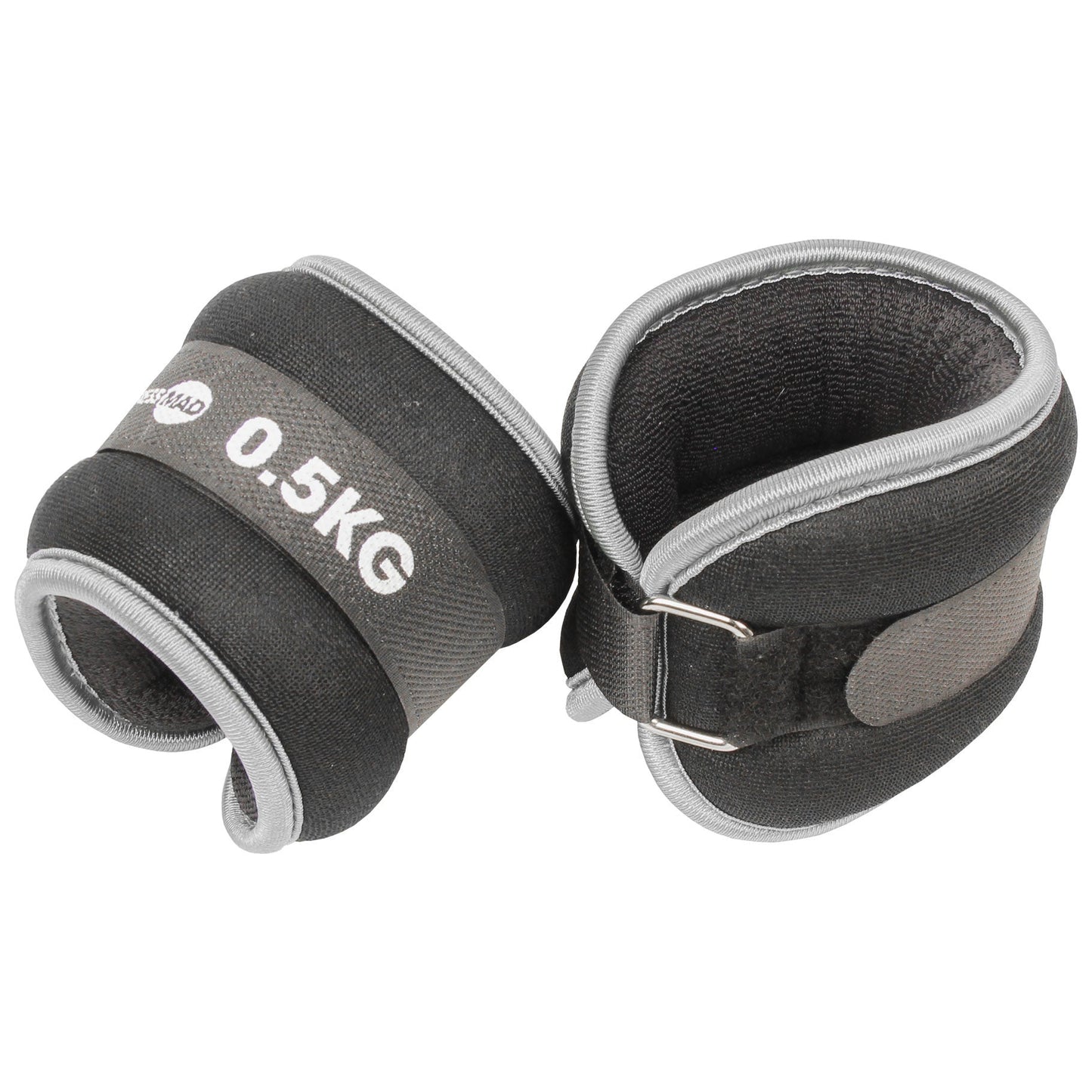 A pair of black and gray adjustable wrist weight plates with metal buckles, one showing '0.5KG' printed in white.