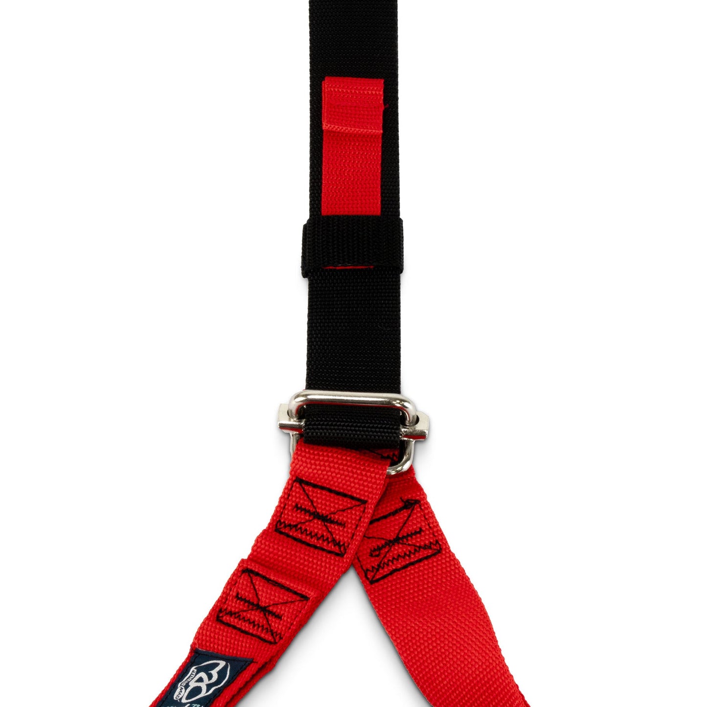 A close-up of a red and black webbed strap with a silver metal D-ring connector, shown against a plain white background.