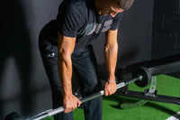 Black under armour t-shirt with white diagonal stripe pattern featured with fixed rubber barbell sets uk delivery