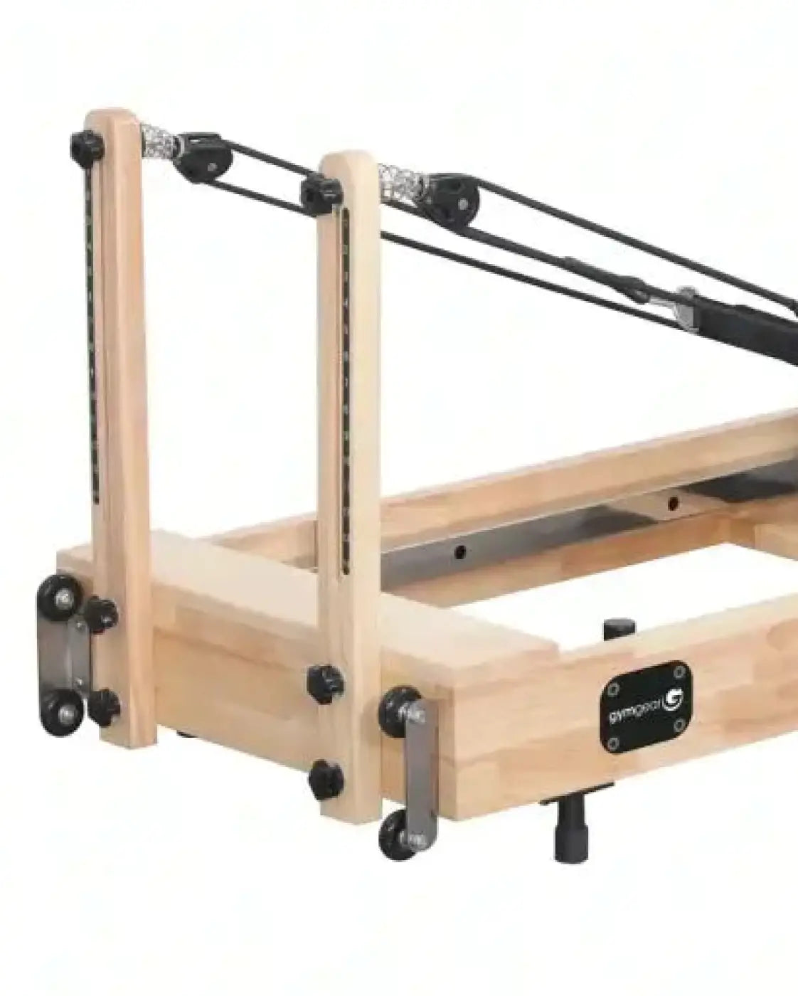 Foldable reformer with light oak wooden frame and black metal parts featuring gymnopro brand plate uk delivery