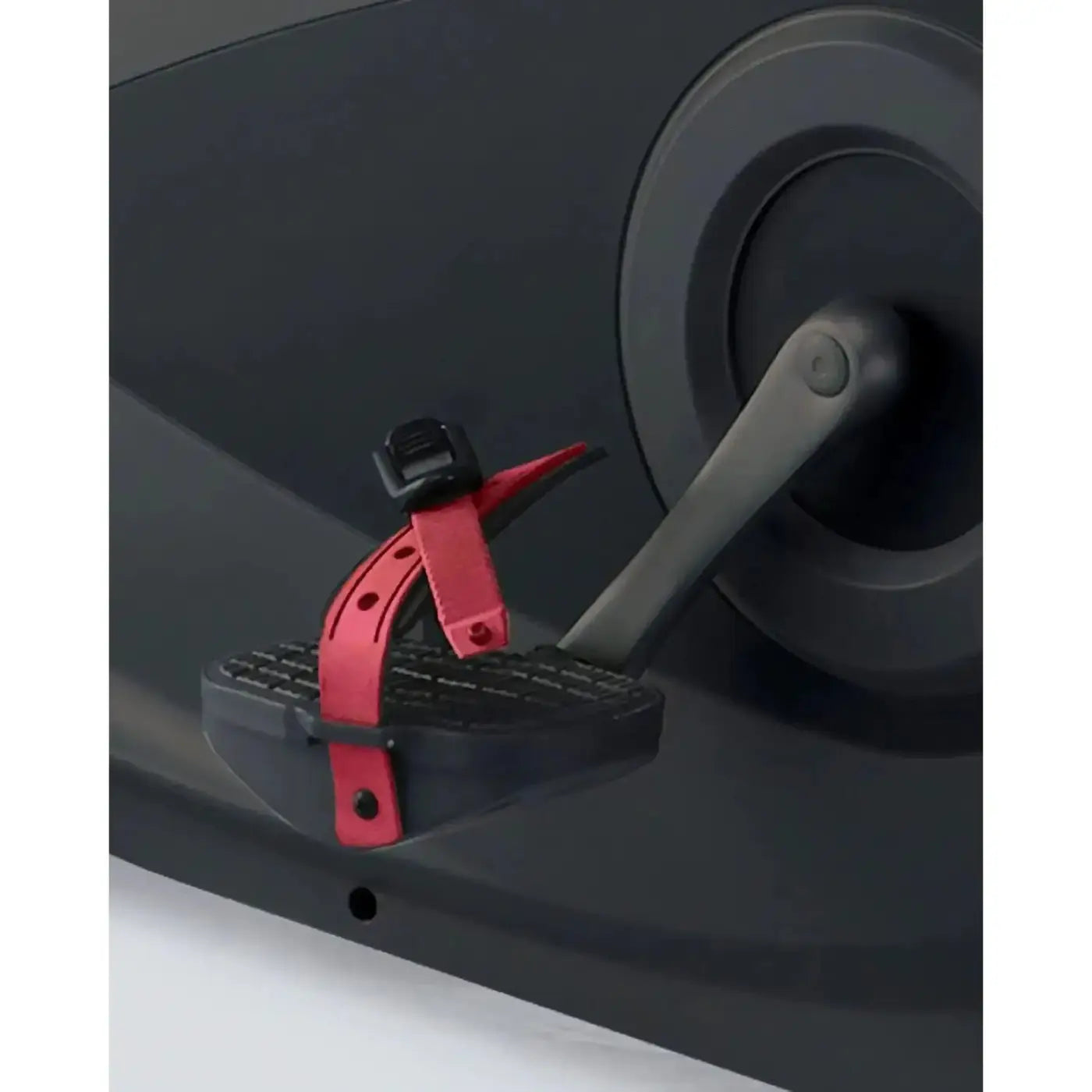 Red adjustable strap with black buckle attached to gray pedal of gym gear b8e entertainment upright bike
