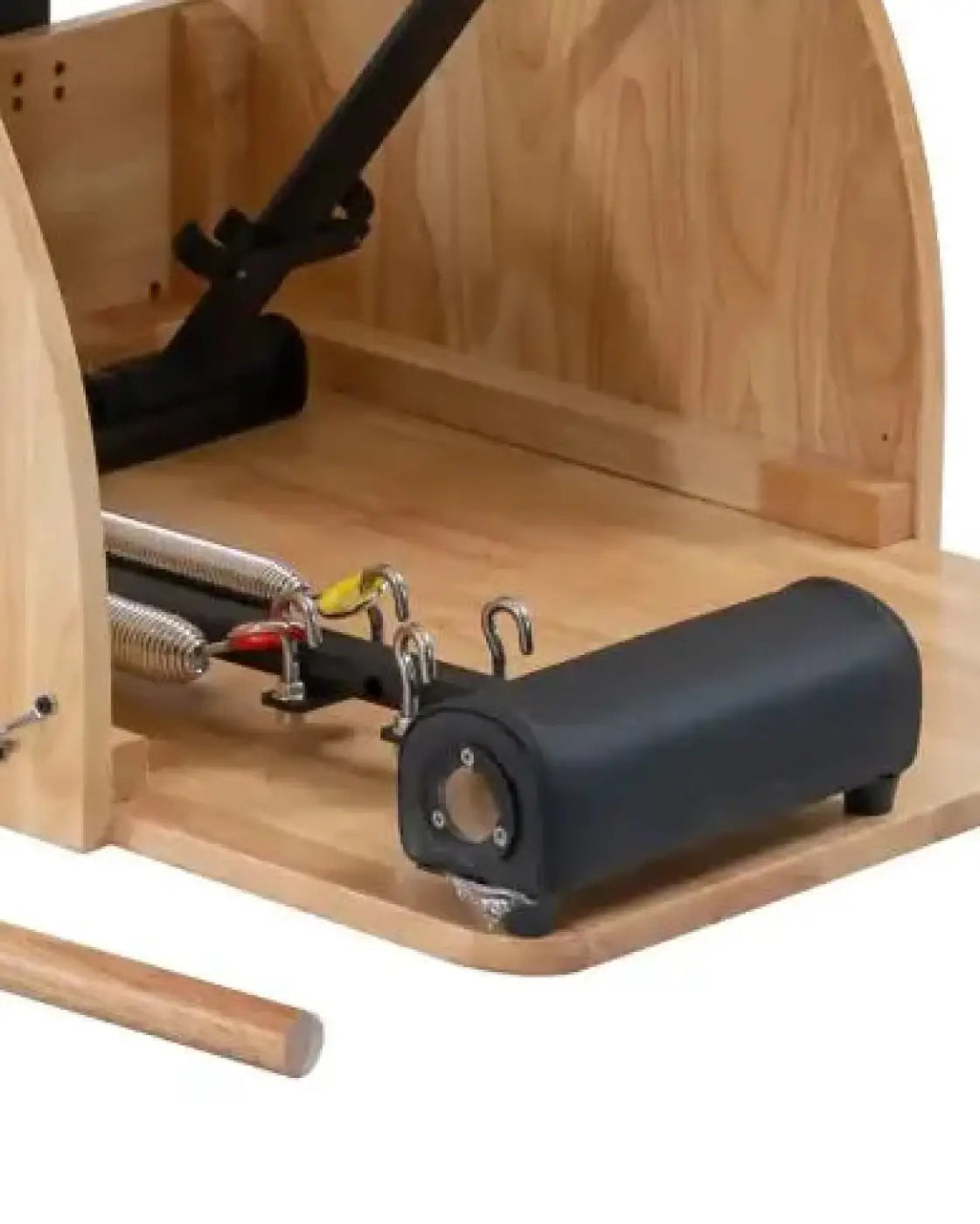 Black padded roller with metal hardware on wooden pilates wunda chair for gym gear combination uk delivery