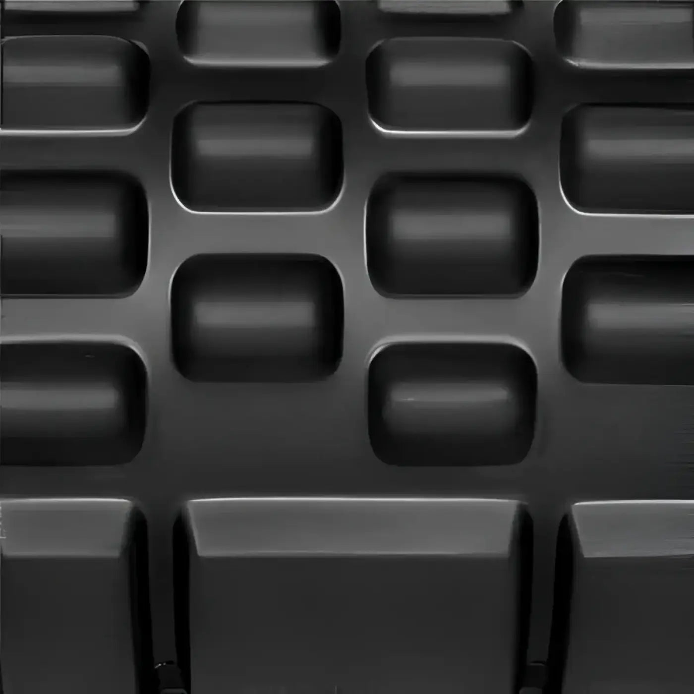 Black rubberized gym gear deep tissue foam roller surface with a grid of raised rectangular bumps uk delivery