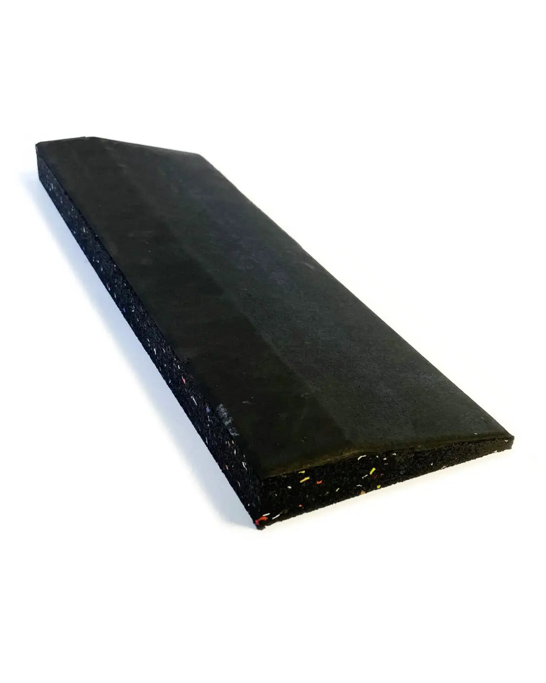 Black rubberized wedge-shaped gym floor edge with textured speckled edges for home workout flooring protection