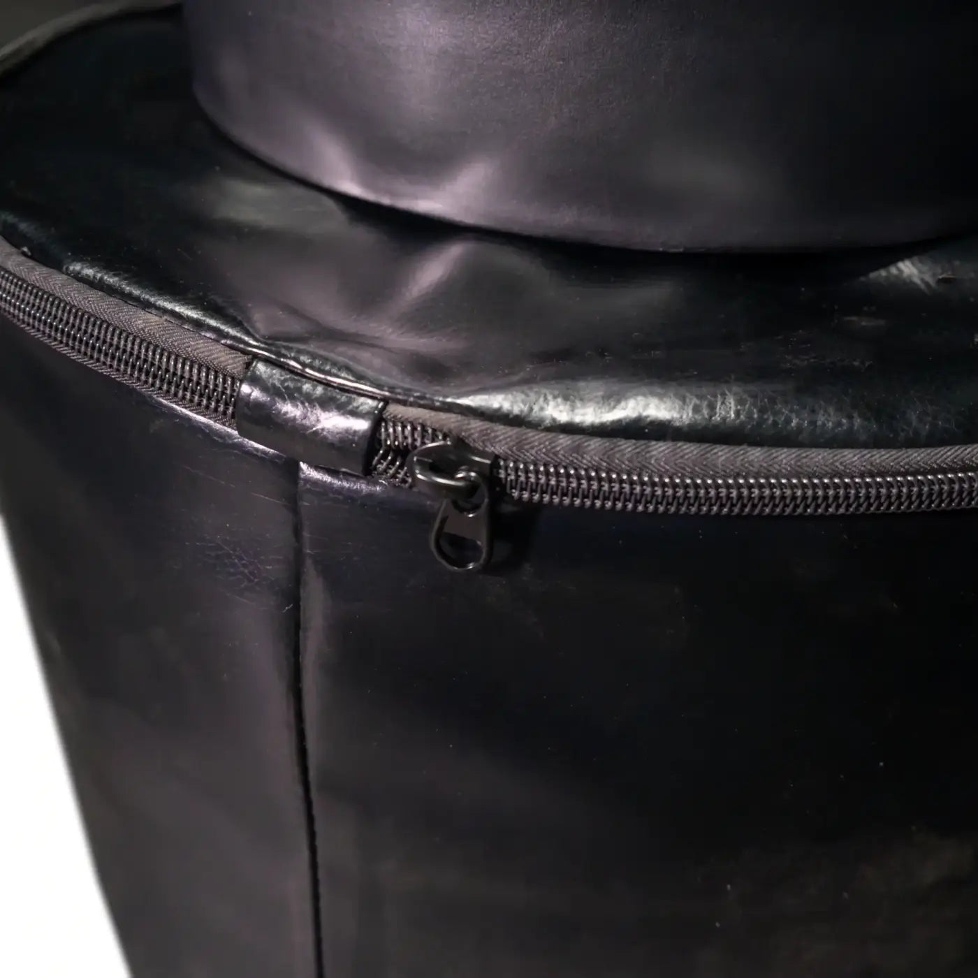 Black leather free standing boxing bag with zipper closure designed for gym use and UK delivery available