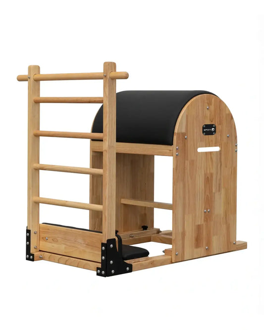 Light-colored wooden gym gear ladder barrel with black padded surfaces and a curved arch design for space-saving use