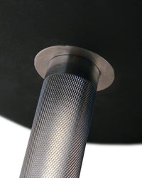 Silver metallic cylindrical handle with a textured diamond plate finish on gym gear pro urethane dumbbells uk delivery