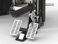 A close-up of a vehicle brake and accelerator pedal assembly with two silver metal slotted pedals on a black mounting base, shown against a clean light gray studio background.