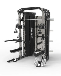 A black and silver industrial strength training cage with an attached barbell rack, pull-up bars, and foot pedals, shown on a clean white background. The brand name 'RHINO' is printed vertically on the center frame.