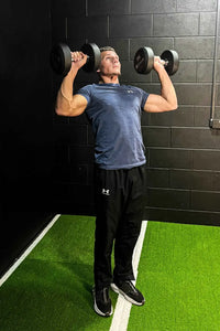 Black rubber dumbbells set with matte finish and silver weight plates for home gyms gym gear collection