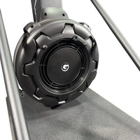Black circular speaker with rugged textured casing and central logo featured on gym gear ski max 2.0 ski erg machine