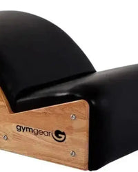Black leather gymnastics bench with wooden frame and gymgear logo for home fitness spine correction