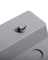 Gray plastic gym gear studio aerobic step with black and gray circular knob for home gym use