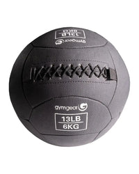 Dark gray textured fabric 13lb 6kg medicine ball with black stitching by Gym Gear for home gym wall ball workouts