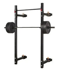 Black metal Gym Gear Warrior folding wall rack with adjustable safety bars and weight plates mounted on barbell