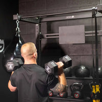 Black hexagonal gymnova dumbbells with 15kg weight markings for hiitmax training station home gyms