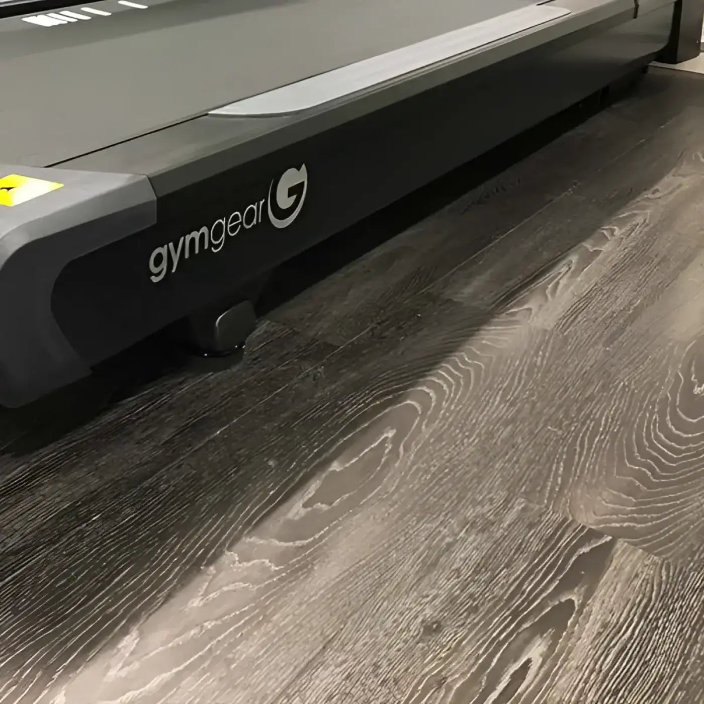 Black gymgear treadmill with sleek modern design and matte finish featured in karndean flooring UK delivery