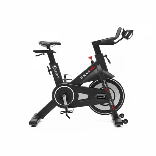 Black m sport elite upright exercise bike with red accents and modern design for home gym use in the UK