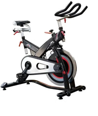 Black and silver stationary indoor studio bike with red flywheel accents for home workouts m sport sport model