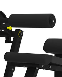 Pro series abdominal crunch fitness machine with a black padded roller and yellow adjustment knobs for home use