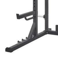 Black metal pro series half rack with adjustable safety bars and weight plate holders for home fitness use