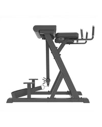 Black metal pro series plate loaded reverse hyperextension bench with adjustable weight stack and padded seat for home fitness