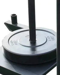 Black weight plate with embossed markings and central hole resting on black base for prower sled uk delivery