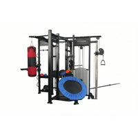 Spartan Studio Rig home workout station with black metal frame, red and black punching bag, blue trampoline pad, and fitness equipment