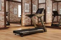 Black and gray Sprint LC light commercial treadmill with 3.5 HP motor and digital display screen, Zwift compatible