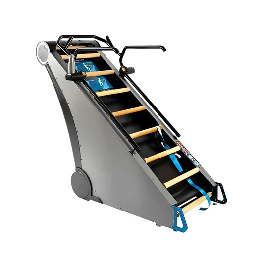 Gray metal StairMaster Jacobs Ladder X stair climber with wooden steps and black handrails shown from the back side
