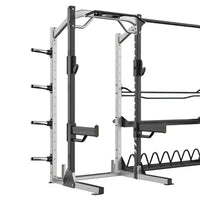 Sterling Series elite half rack in black and silver metal with adjustable safety bars and cable system for home gyms