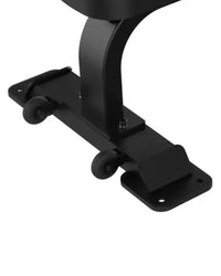 Black metal glide plate with two small wheels on the back of sterling series flat bench for home fitness use