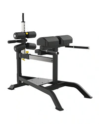 Black metal sterling series glute ham bench with adjustable weight plates and padded seating for uk delivery