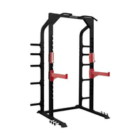 Elite Series half power rack in black and red with adjustable safety bars and multiple attachment points for home training