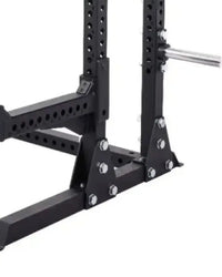 Black metal elite series half power rack with perforated uprights and bolted triangular base supports for home training