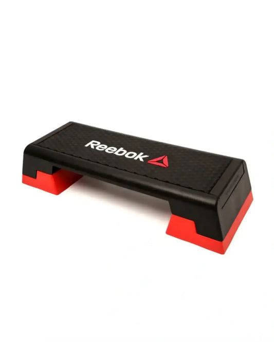 Black and red reebok step platform with textured surface for home gym workouts and aerobic exercises
