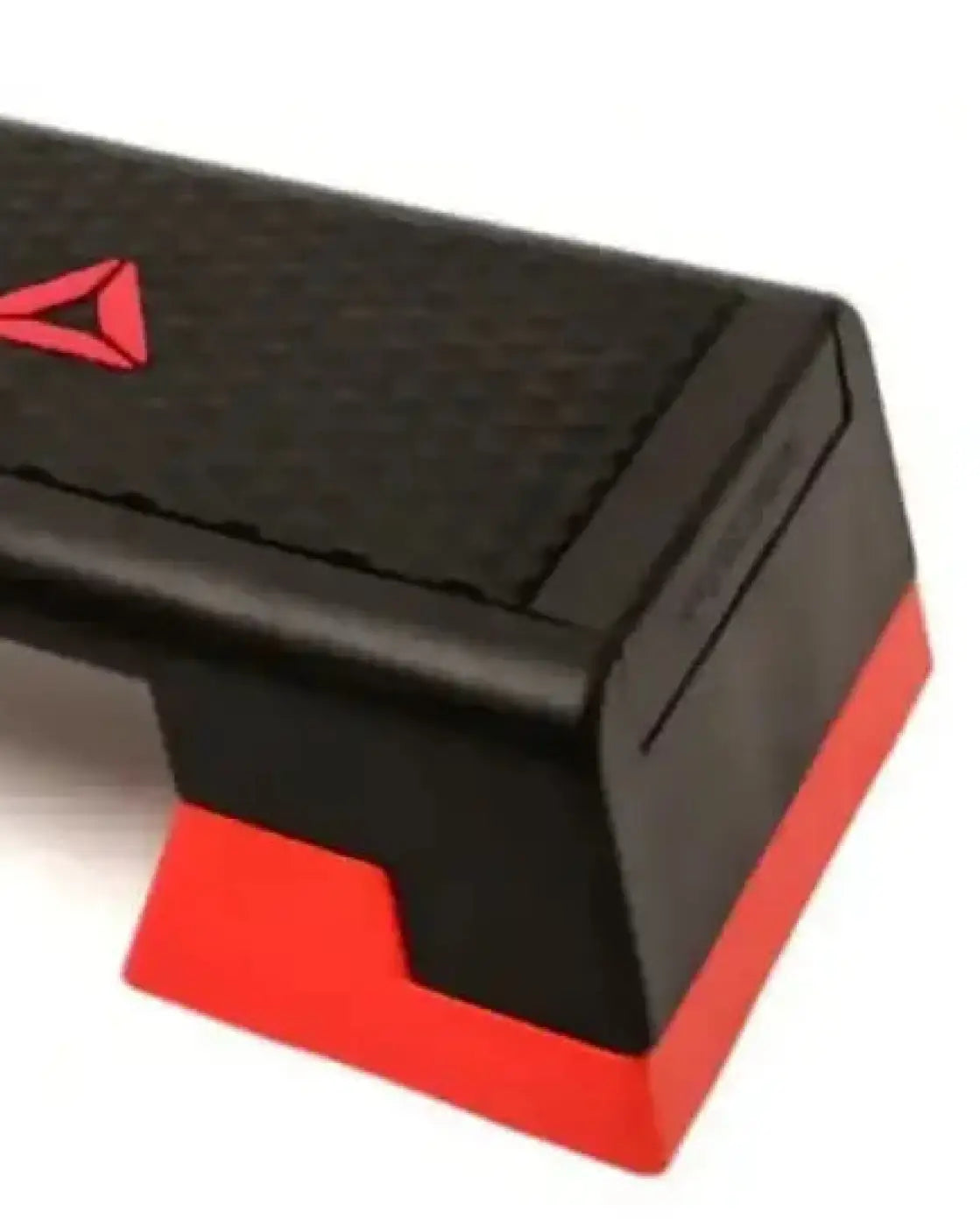 The Reebok Step home gym platform in black and red with a textured grip surface for secure step workouts