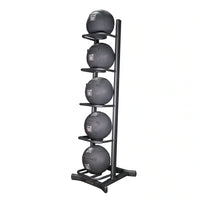 Black rubber medicine balls neatly arranged vertically on a black metal wall ball storage rack holding five for home workout