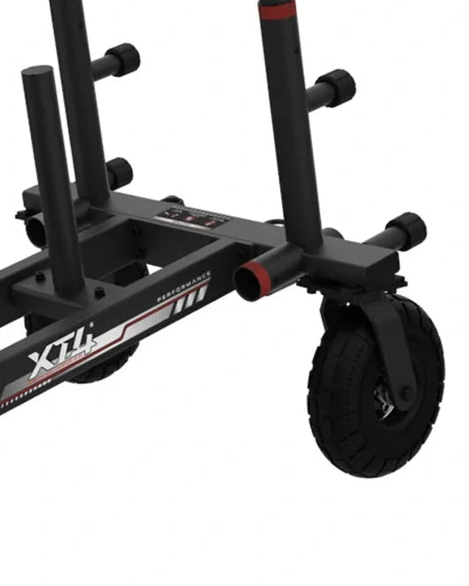 Close-up of the XT4 Power Sled frame showing the front swivel caster wheel and weight peg attachments