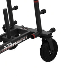 Close-up of the XT4 Power Sled frame showing the front swivel caster wheel and weight peg attachments
