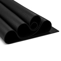 Yoga mad studio mat curled up on white background